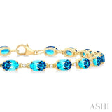 6X4 MM Oval Cut Blue Topaz and 1/6 ctw Round Cut Diamond Semi Precious Tennis Bracelet in 10K Yellow Gold