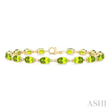 6X4 MM Oval Cut Peridot and 1/6 ctw Round Cut Diamond Semi Precious Tennis Bracelet in 10K Yellow Gold