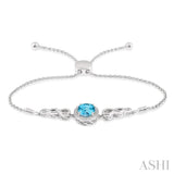 10x8 MM Oval Shape Blue Topaz and 1/20 Ctw Round shape Diamond Sterling Silver Lariat Bracelet