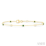 1.8 MM Emerald and 1/10 ctw Bezel Set Round Cut Diamond Precious Gemstone Station Bracelet in 14K Yellow Gold