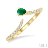 4X3 MM Pear Cut Emerald and 1/10 ctw Petite Round Cut Diamond Precious Fashion Ring in 10K Yellow Gold